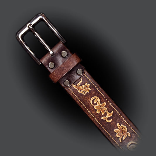 Brown leather belt with a silver buckle, decorated with floral embossing.