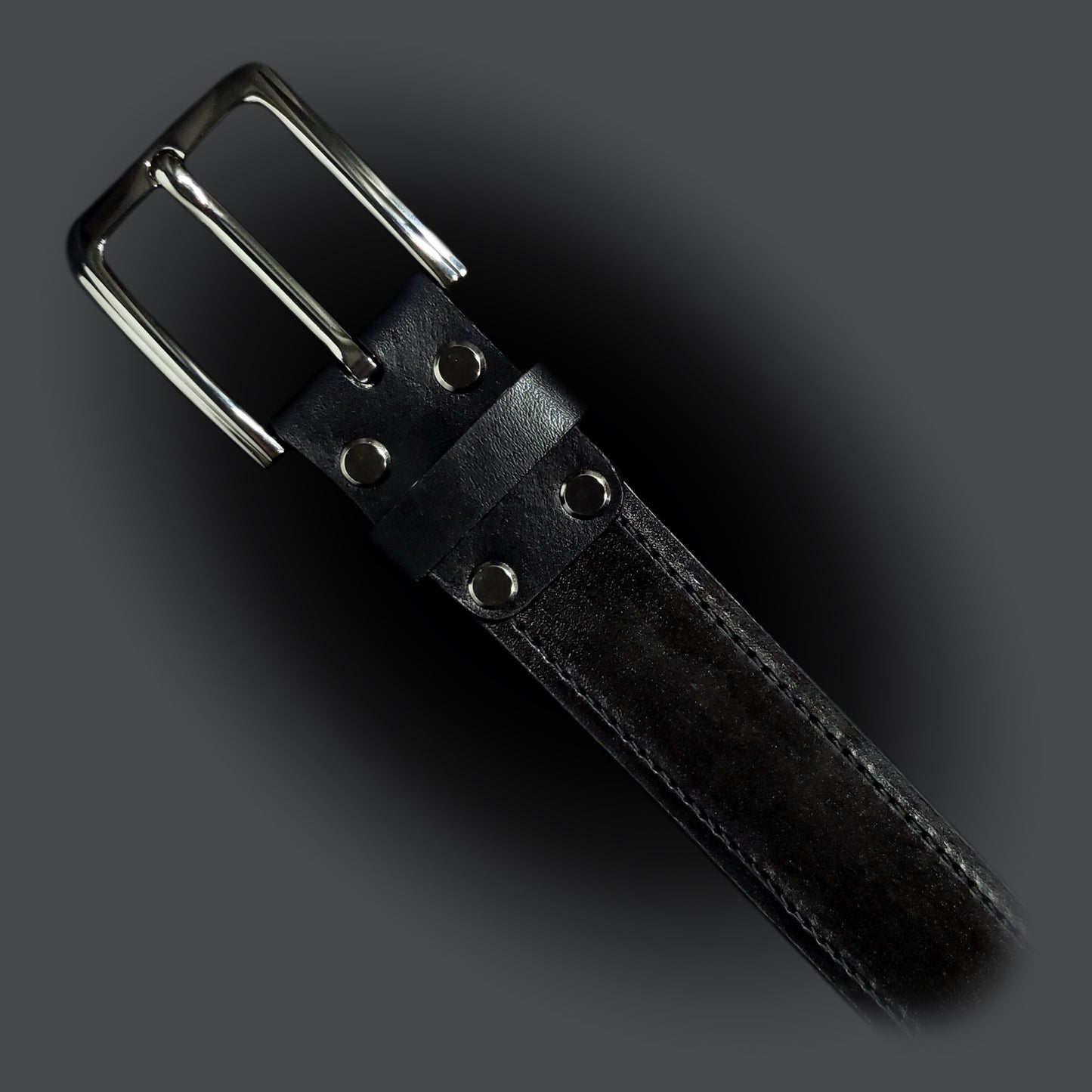 Black leather belt with black stitching and a gun metal buckle.