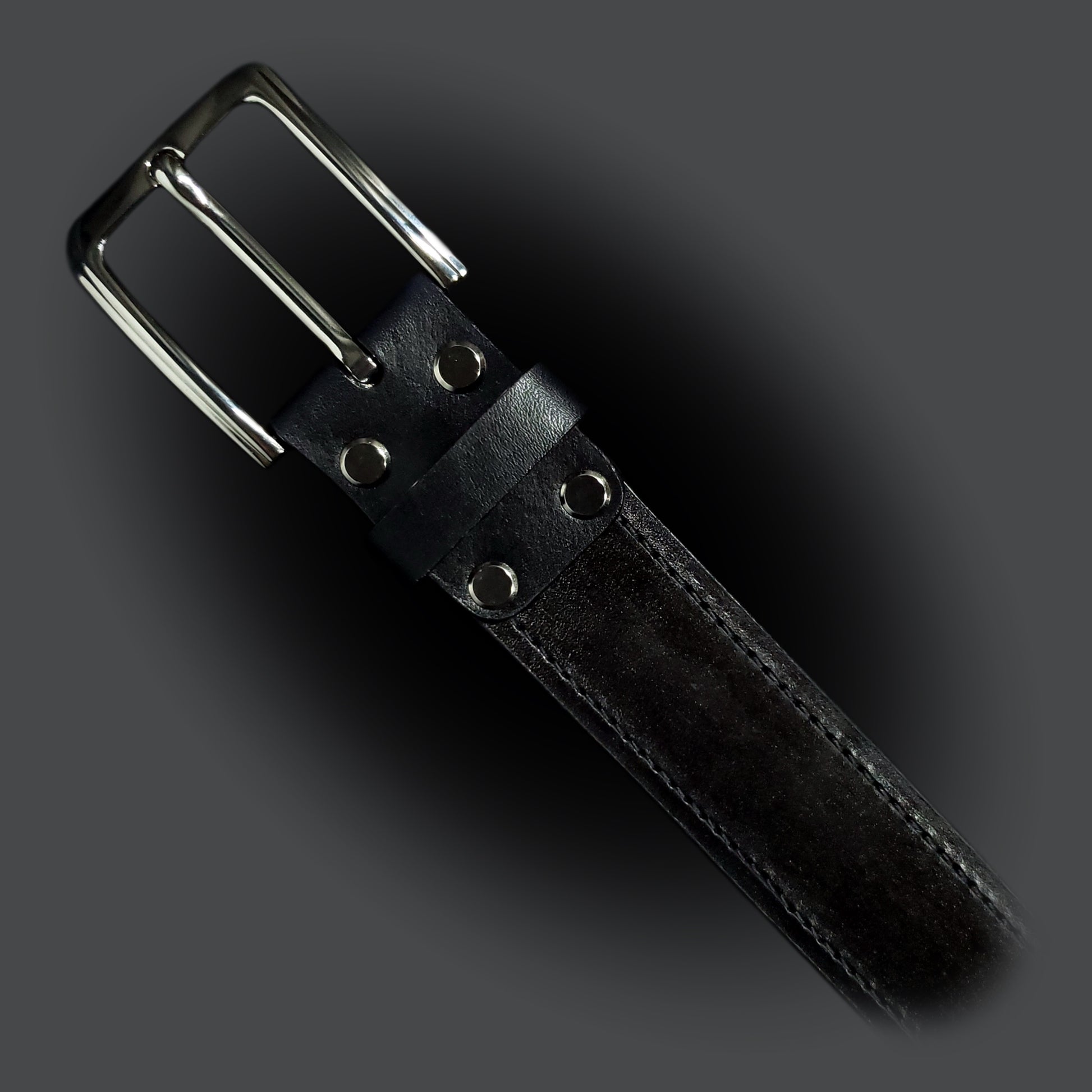 Black leather belt with black stitching and a gun metal buckle.