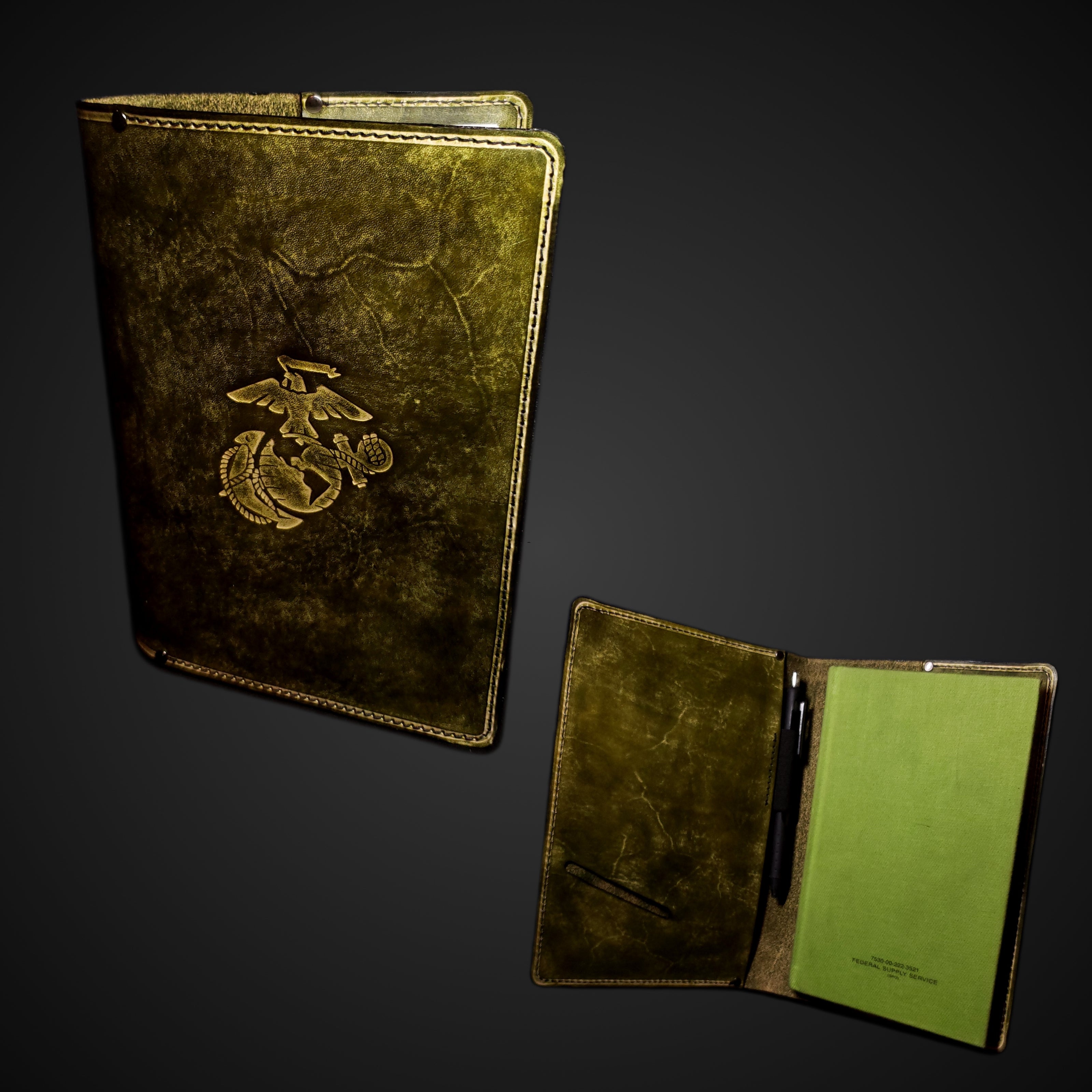 Olive green leather journal cover embossed with the Marine Corps emblem.