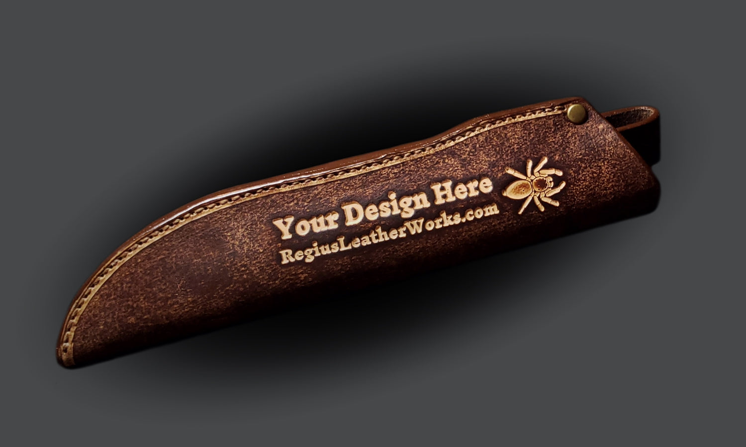 Brown leather knife sheath with the Regius logo and embossed text that says "Your design here".