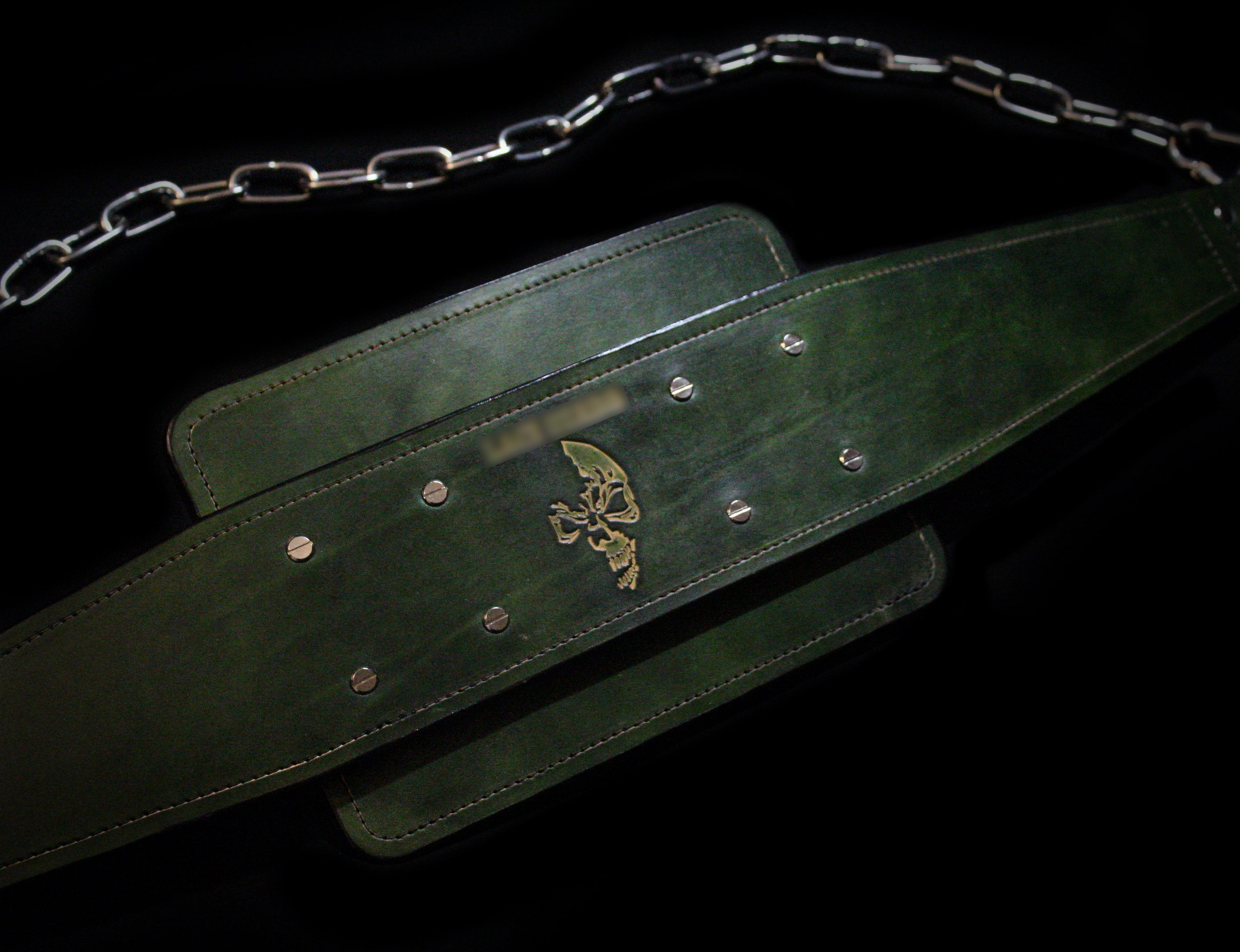 Green heavy weight lifting belt with an embossed skull design and chrome chain