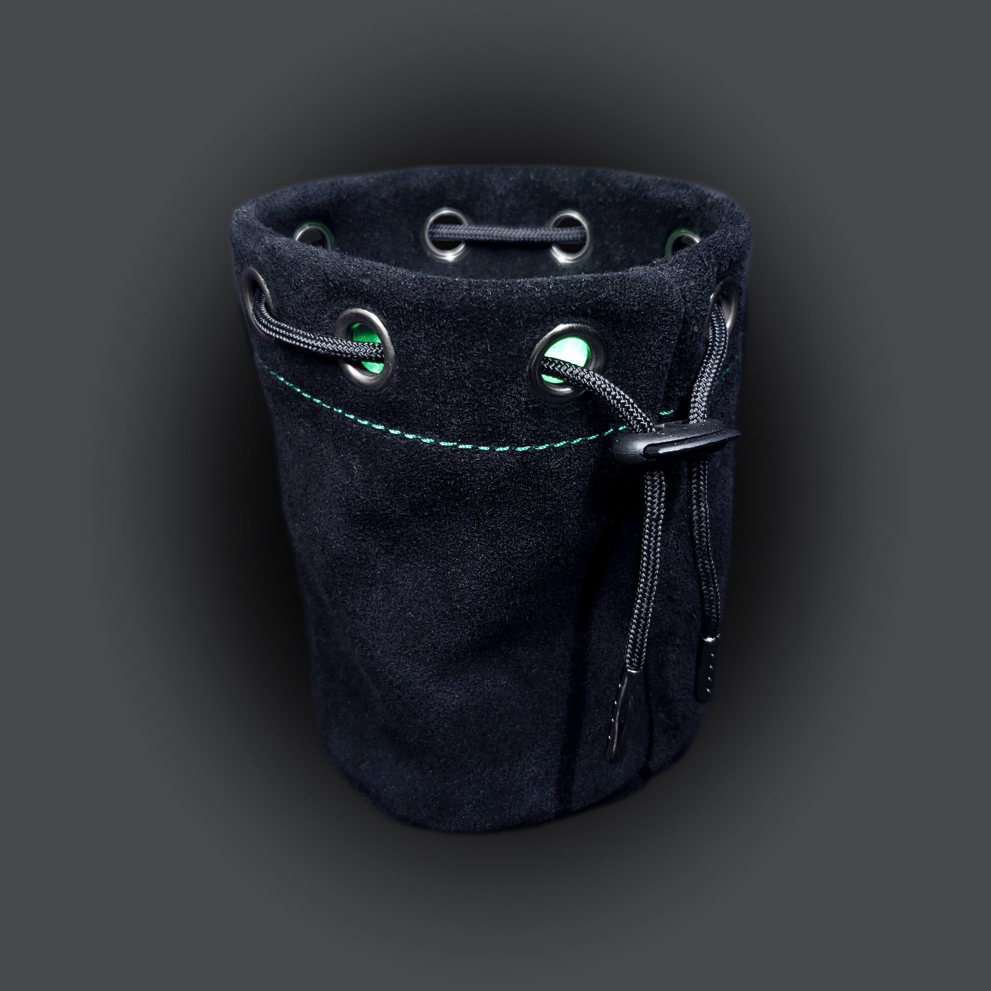 Black suede leather pouch with a green satin interior and black drawstring.