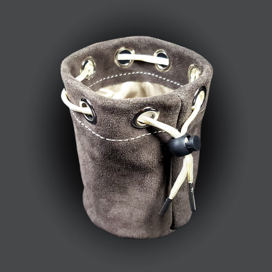 Grey suede leather pouch with a champagne colored satin interior and matching drawstring.