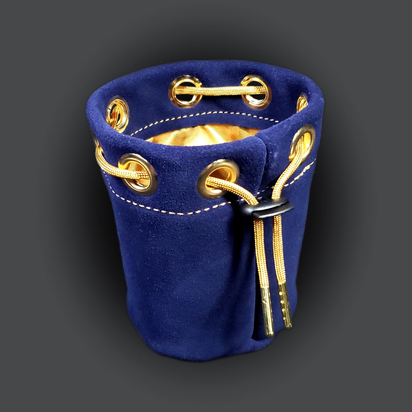 Navy blue suede leather pouch with a gold satin interior and gold drawstring.