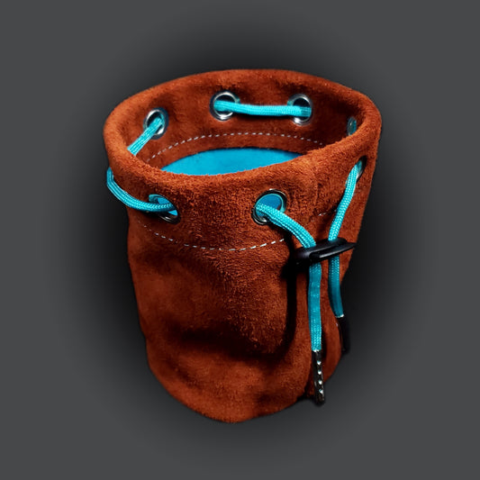 Light brown suede leather pouch with a light blue cloth interior and light blue drawstring.