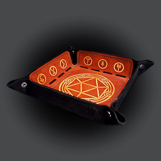Black and brown leather dice tray decorated with dungeons and dragons icons, viewed from the front.