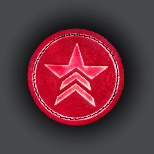 Red leather velcro patch embossed with a star symbol with chevrons from the Mass Effect franchise.