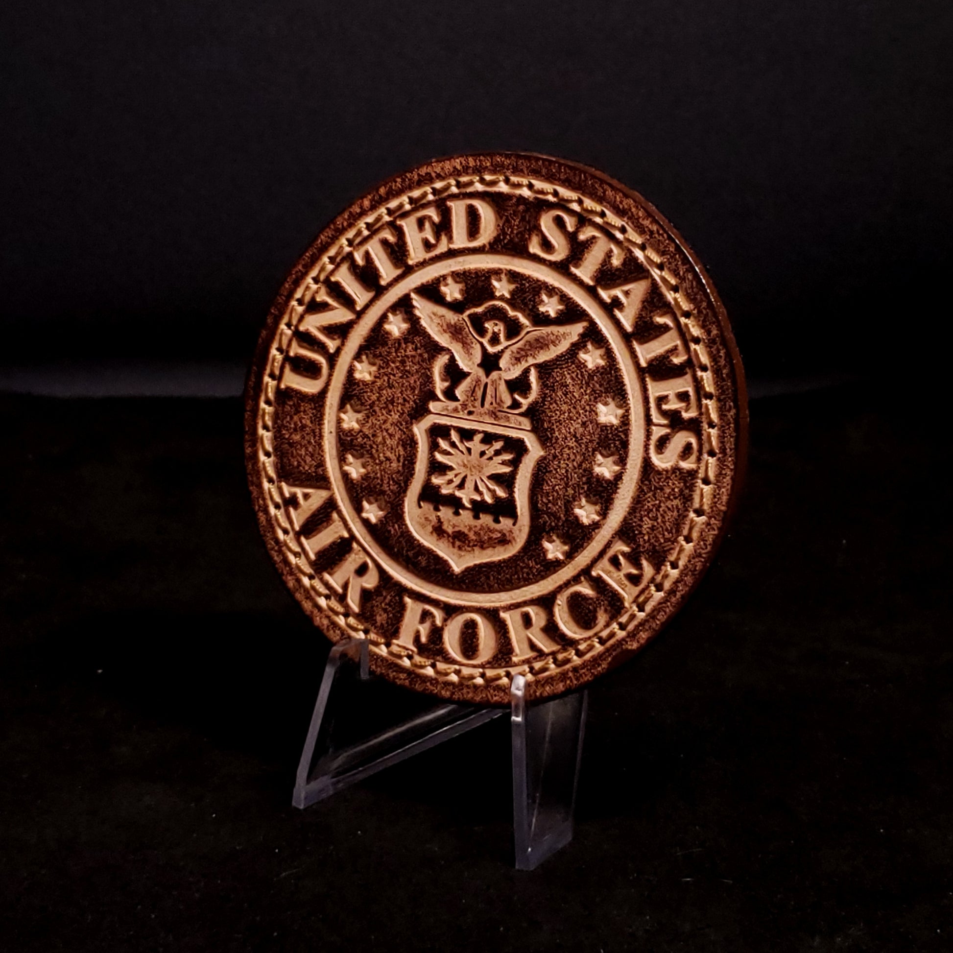 Brown leather velcro patch embossed with text and the United States Air Force emblem, posed on a black background.