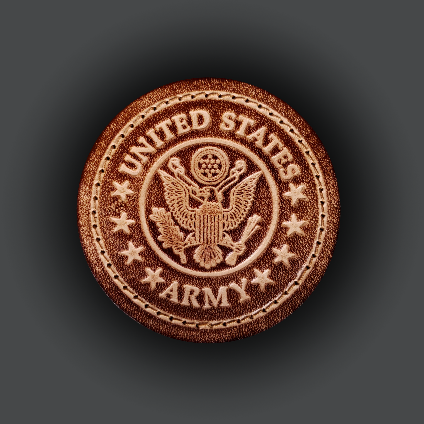 Brown leather vecro patch featuring the united states aremy emblem.