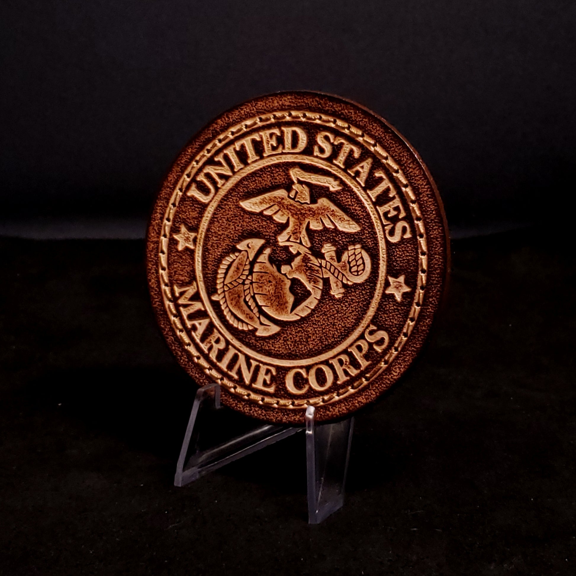Brown leather velcro patch embossed with text and the United States Marine Corps eagle, globe, and anchor.