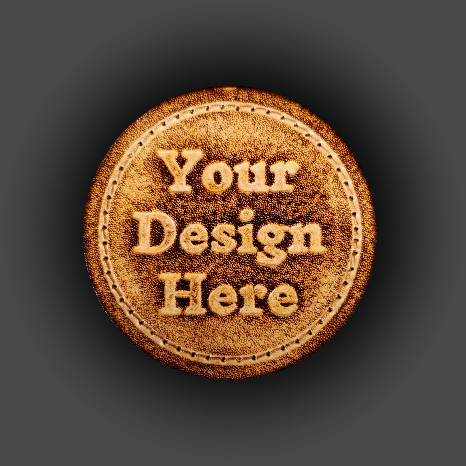 Brown leather velcro patch with embossed text that says "Your design here".
