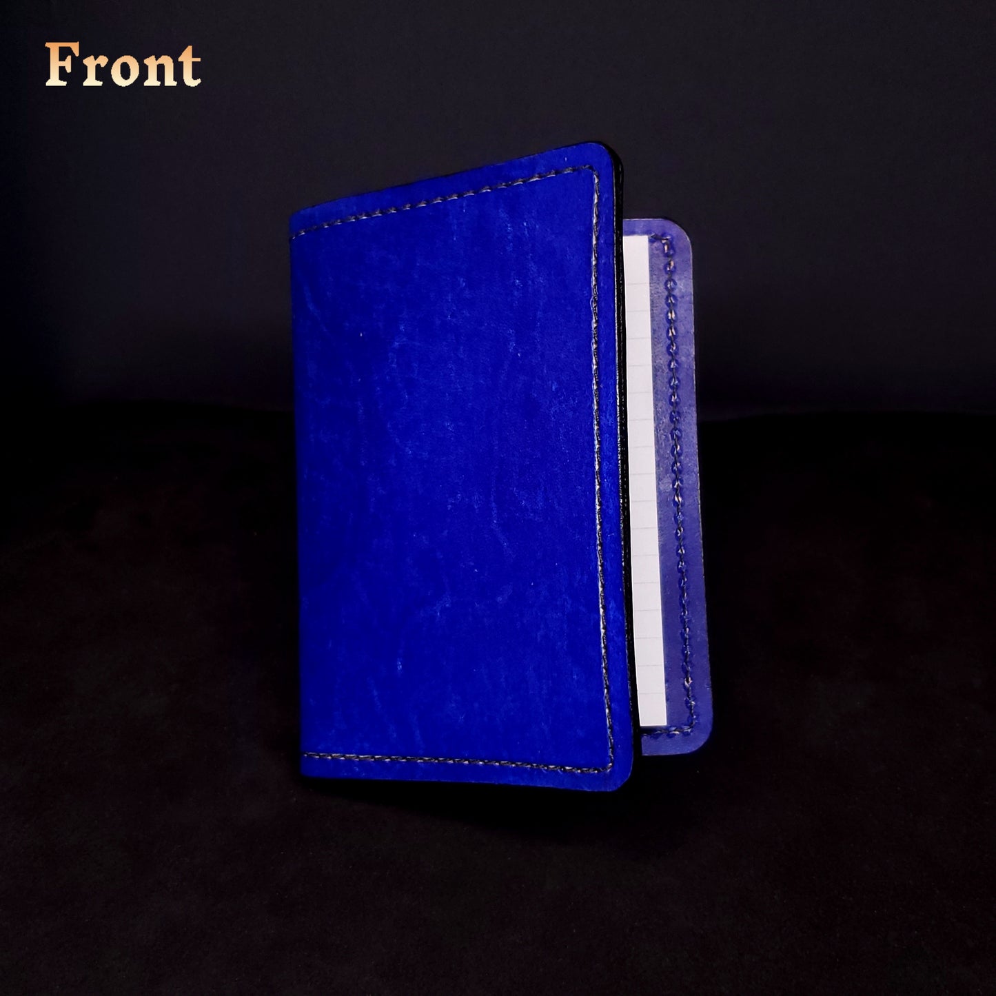 Blue leather mini-composition cover, closed and viewed from the front