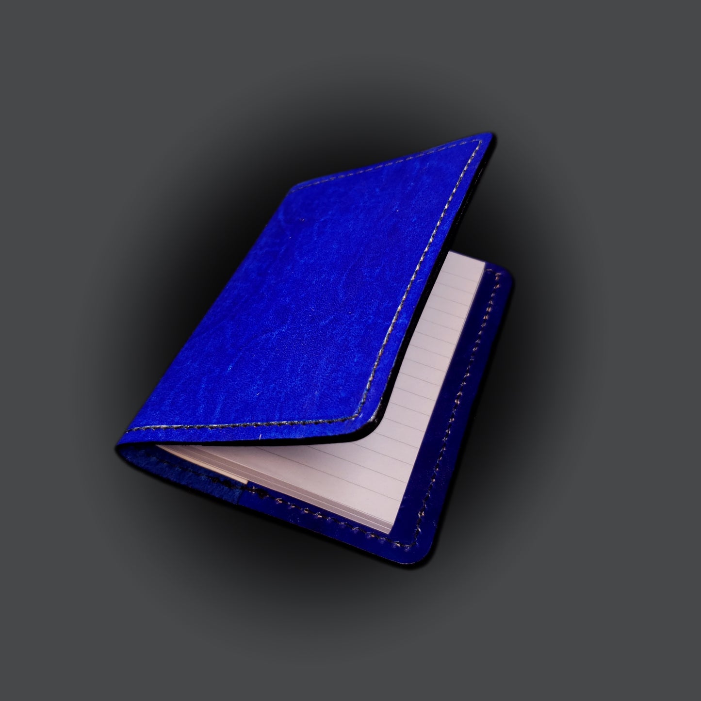 Blue leather mini-composition cover on a grey background