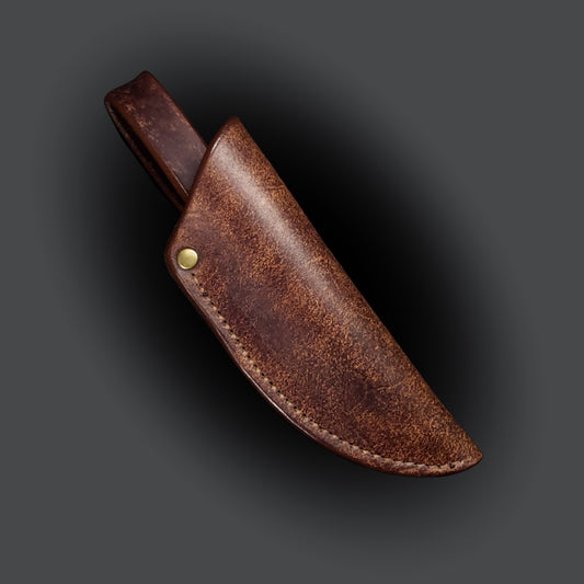 Brown leather knife sheath on a grey background.