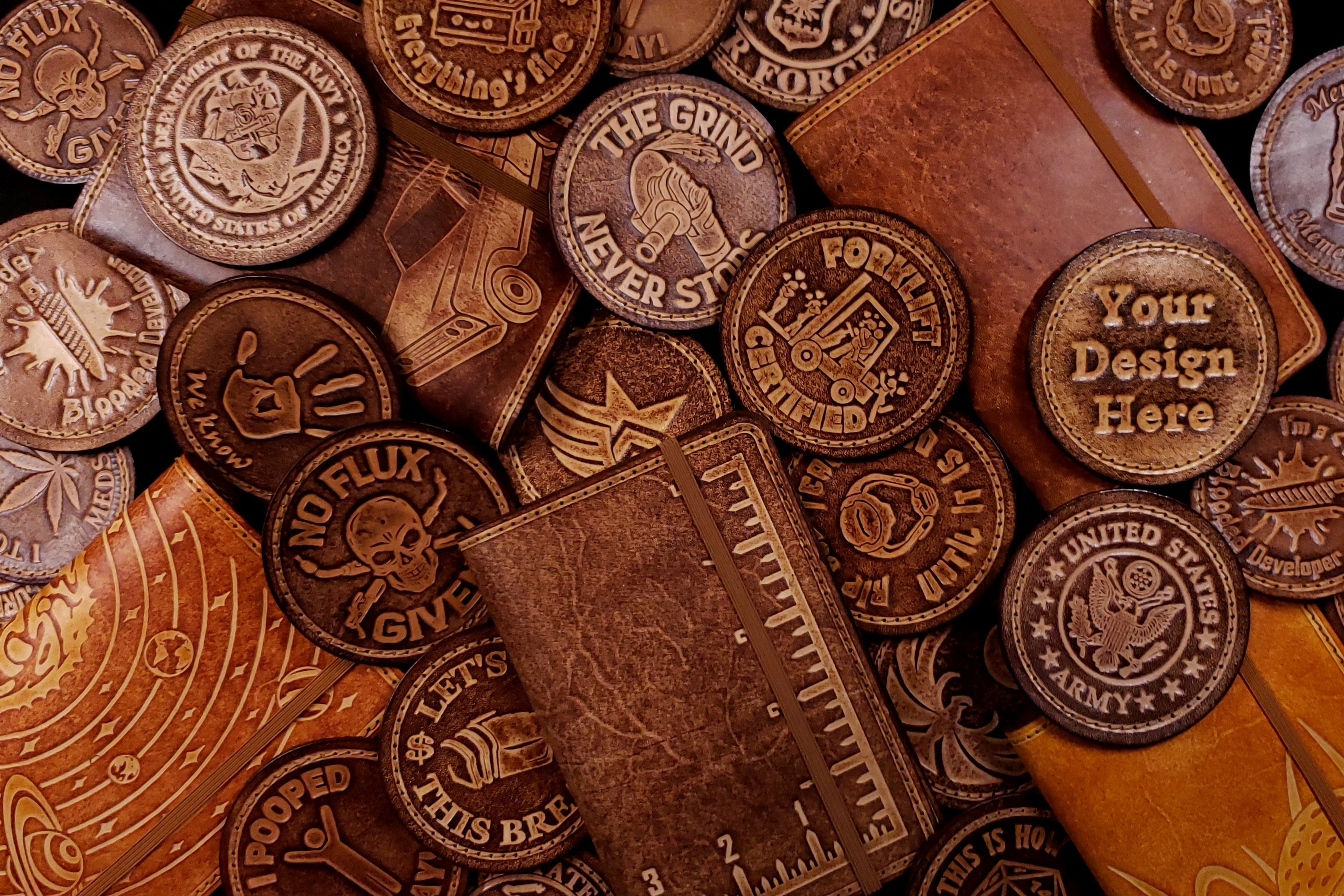 A collage of leather book covers and velcro patches made by Regius Leather Works.